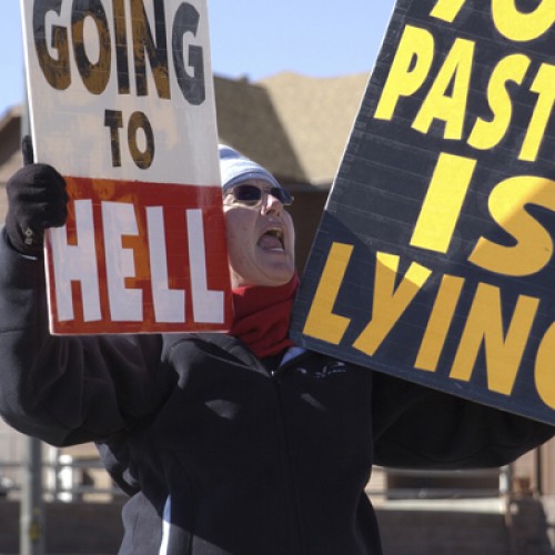 Members of Fred Phelps' movement protest in front of church in Lakewood, CO.